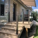 glass railing with brown aluminum posts