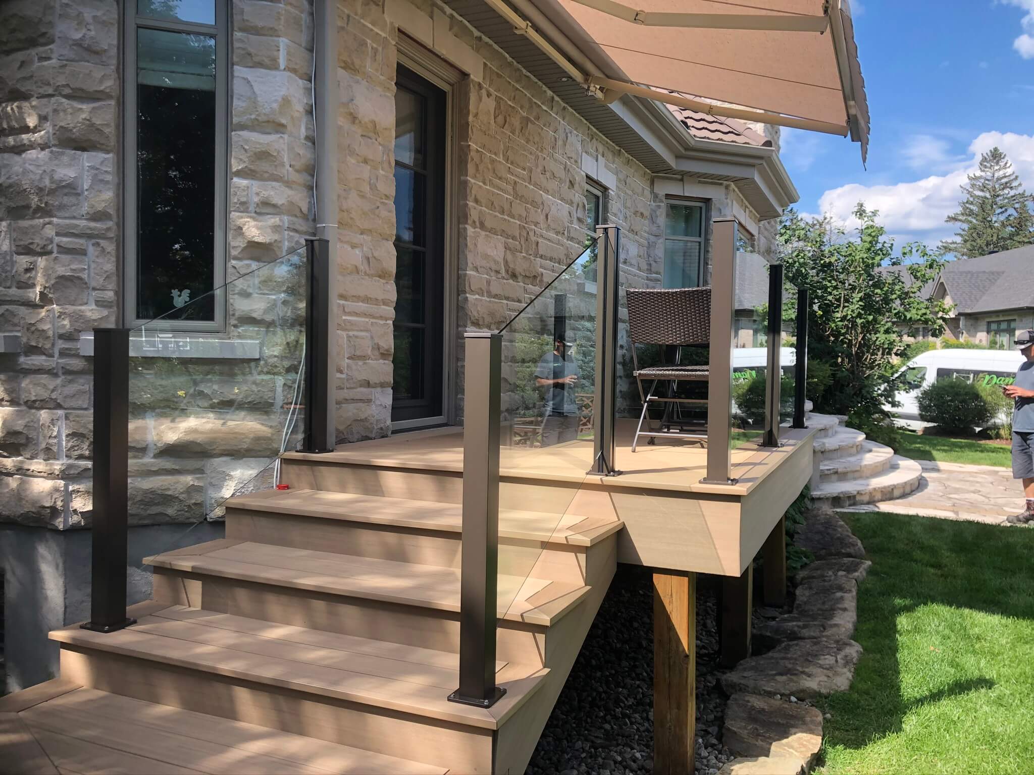 glass railing with brown aluminum posts