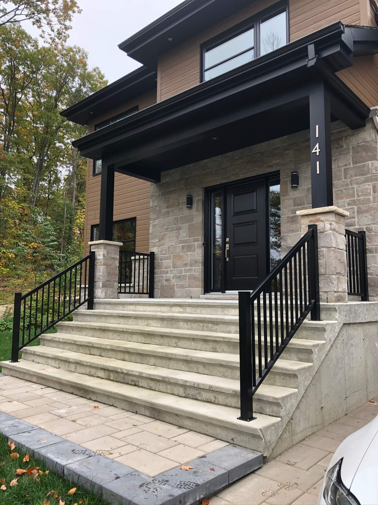 concrete staircase with black aluminum railings 01