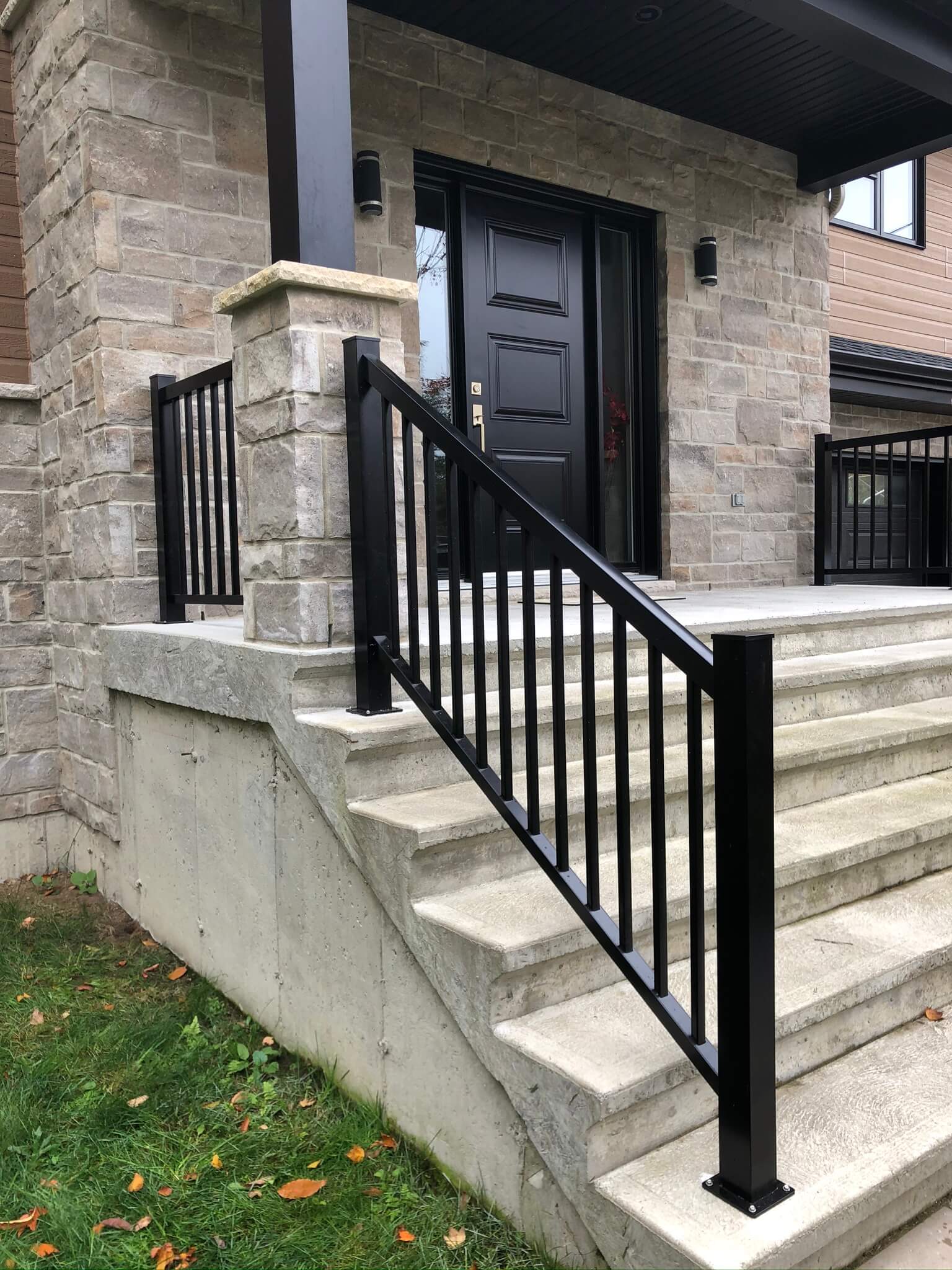 concrete staircase with black aluminum railings 03