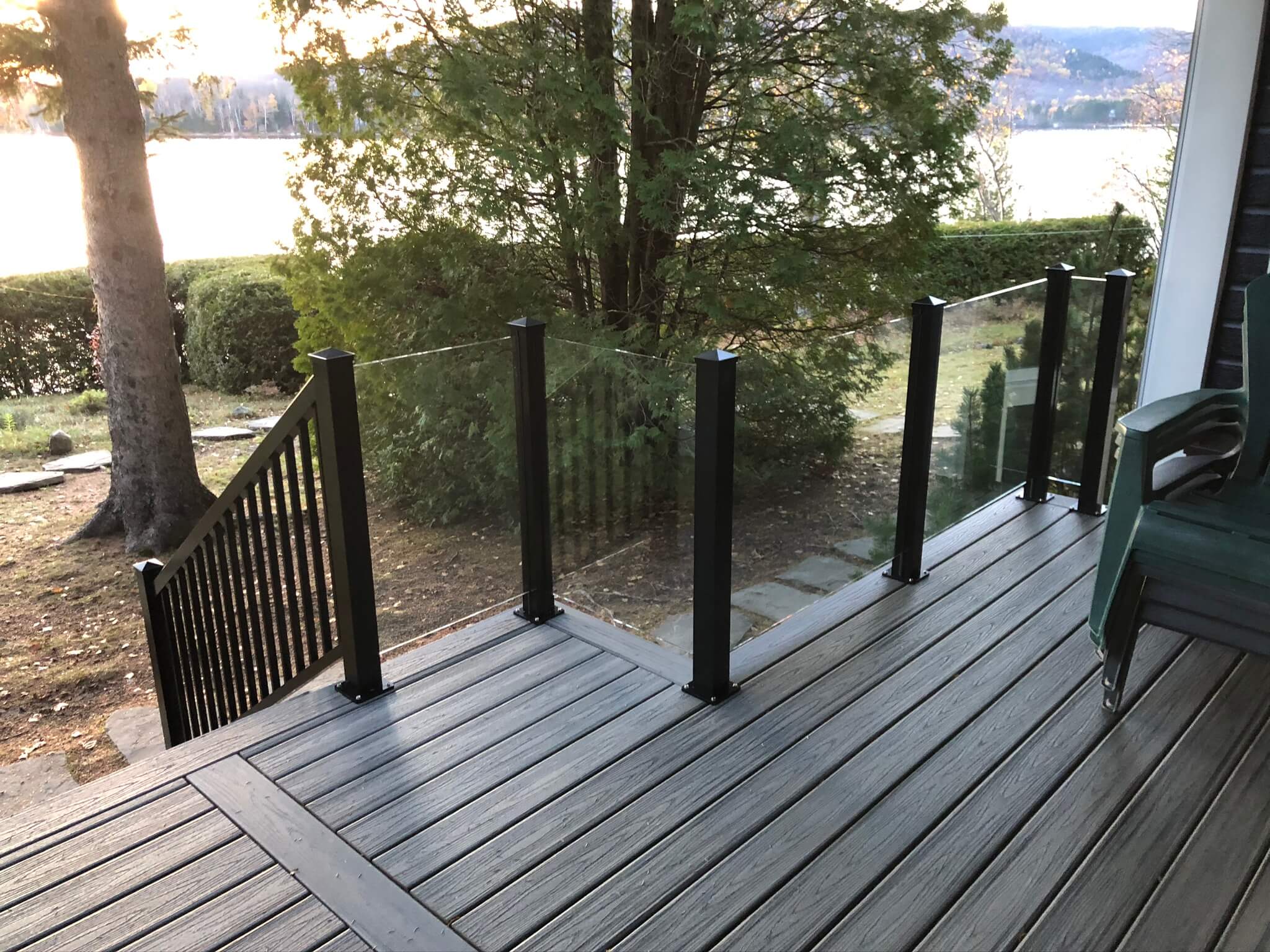 balcony with glass railing and aluminum post